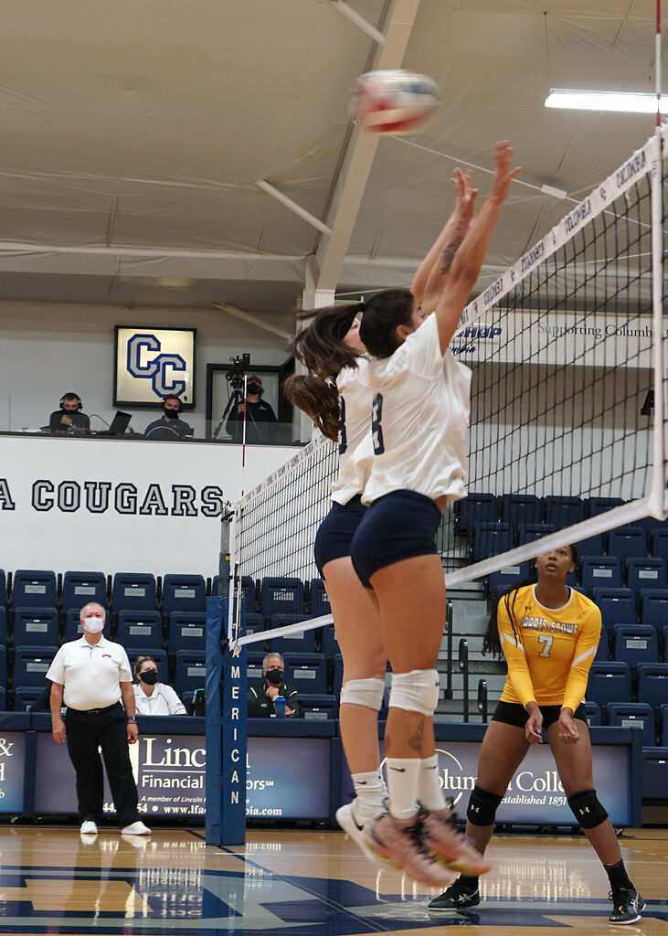 Columbia College sophomore Luisa Ferreira, right, and senior Erika Miller go up for a block on Monday at Southwell Complex.